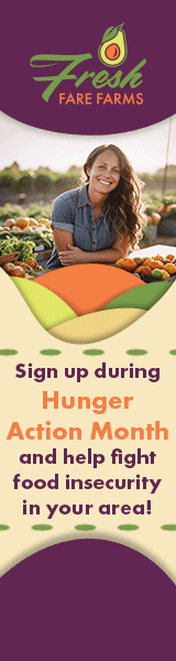 An orange crescent moon with a woman's silhouette and flowing hair over it